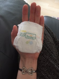 Pampers P3 nappy in palm of hand
